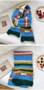 Detailed macro shot of soft colorful striped knit scarf texture and fringe accents