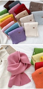 Detailed macro view showing diverse color options and ribbed knit texture of soft scarves