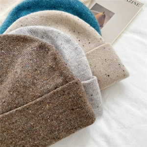Cozy speckled knit beanies for winter in multiple colors including brown and grey