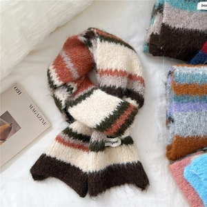 Colorful striped mohair knit scarf with cozy plush texture and brand woven label