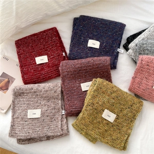 Chic knit cross scarf for women in multi-color melange yarn with ins label detail