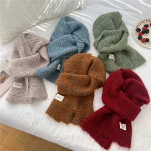 Cozy two-tone knit scarves in multiple colors for winter warmth and soft texture