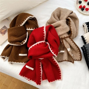Thick knit scarves in brown, red, and oatmeal with rib texture and hand-stitched edges