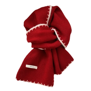 Thick red knitted scarf with white contrast stitching and BOWLOW brand label
