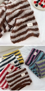 Close-up of soft knit striped scarf texture and assorted color collection set