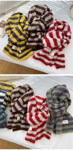 Close-up of winter striped knit scarves with ins label in multiple color palettes