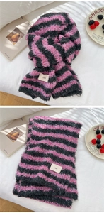 Detail of pink and grey striped knitted scarf with fluffy texture and ins woven label