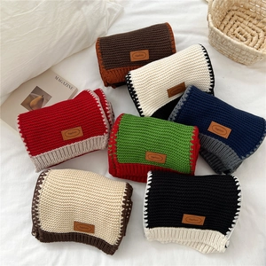 Extra long two-tone knit scarves for winter with leather brand label in diverse color options