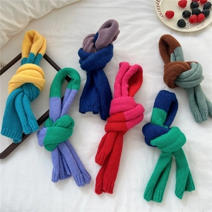 Colorful knitted skinny scarf collection in mixed colors with soft ribbed texture