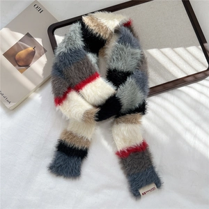 Close-up of colorful striped faux fur scarf with soft plush texture and DORIA DORE label