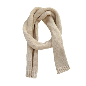 Minimalist cream knit skinny scarf for women with soft ribbed edges and solid texture