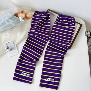 Striped knitted sun protection arm sleeves in purple and yellow with ribbed texture
