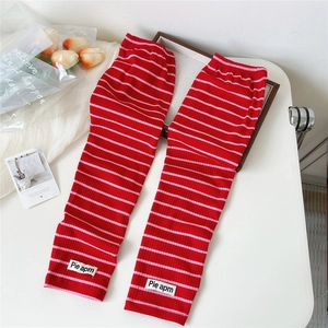 Pink and red striped sun protection cooling arm sleeves with ribbed knit texture