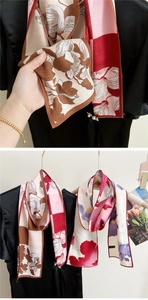 Detail of elegant silk scarf texture with vintage floral patterns and satin luster finish