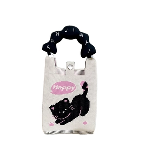 Mini sac à téléphone tricoté aux couleurs acidulées avec poignées noires et broderie chat
