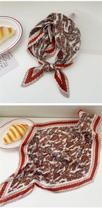 Close-up of pleated square scarf with vintage paisley print and scalloped edges
