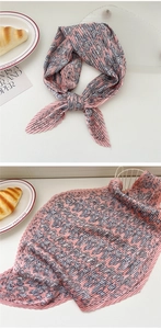 Detailed view of pink pleated silk scarf with blue-grey Paisley pattern texture