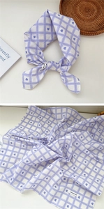 Detail of lavender cotton square scarf with heart pattern and plaid texture on soft fabric