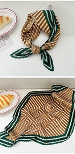 Macro shot of accordion pleated silk scarf featuring retro geometric patterns and wavy edges