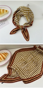 Detail showing the pleated texture and geometric maze pattern on this silk scarf