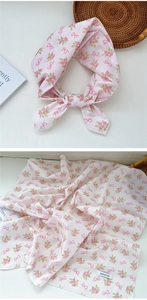 Detail of 100% cotton floral headscarf with pink flowers and red bow patterns