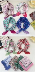 Detailed view of floral cotton linen square scarves with colorful tulip and flower patterns