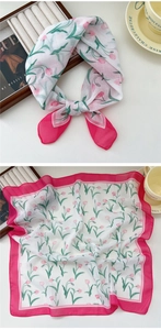 Detail of square silk scarf featuring pink tulip floral print and bright pink borders