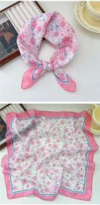 Detail of pink floral cotton linen square scarf showing delicate petal print and soft texture