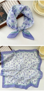 Detail of light purple floral silk scarf with elegant wide contrasting border design