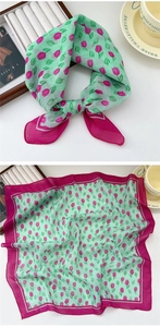 Detail of mint green linen scarf with pink tulip floral pattern and magenta borders