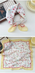 Detail of a floral cotton linen square scarf featuring red and yellow tulips with yellow borders