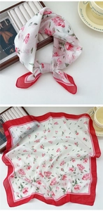Detailed view of floral cotton linen neckerchief with pink roses and red hem edges