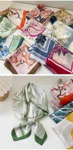 Detail of elegant floral satin scarves featuring rose and lotus patterns with chic knot detail