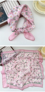 Detail of pink floral square scarf showing fine stitching and soft chiffon texture