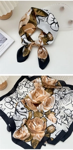 Detail of vintage rose print silk scarf with satin finish and elegant patchwork design