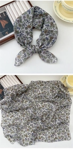 Detail of floral cotton linen square scarf with delicate overlock edges and blue patterns