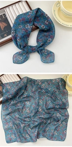 Detail of navy blue floral cotton linen scarf with knotted style and flat layout display
