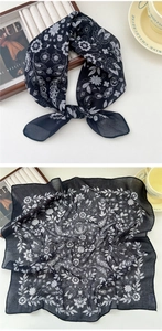 Detailed texture of navy blue floral cotton linen scarf with elegant white flower prints