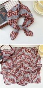 Detail of vintage floral cotton linen scarf with fine hemmed edges and soft texture
