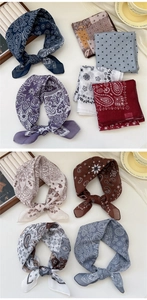 Close-up of cotton linen scarves with paisley and floral prints in various colors