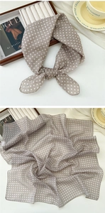 Detail of soft cotton linen square scarf with classic brown and white polka dot pattern