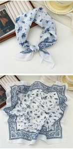 Detail of soft white cotton-linen square scarf with blue floral and paisley pattern print