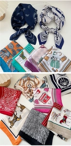 Selezione di foulard in seta con stampe vivaci, motivi paisley ed equestri