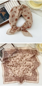 Detail of vintage floral cotton linen scarf with soft paisley border and washing label