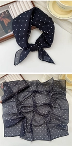 Detail of soft linen-cotton square scarf with classic black and white polka dot pattern
