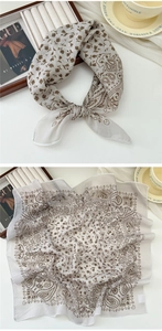 Macro detail of breathable cotton linen scarf with vintage brown paisley floral print