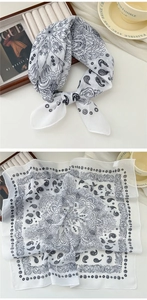 Detail of white cotton linen square scarf with black paisley and mandala patterns