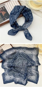 Detail of navy blue paisley cotton linen scarf with breathable textured fabric weave