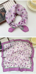 Detail view of a square floral scarf featuring purple tulips and dotted patterns
