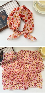 Macro detail of breathable square scarf with vintage floral print and sheer fabric texture